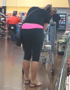 Girl in short tights and sandals supermarket photo