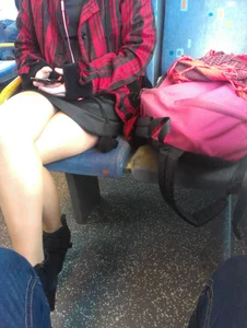 Candid Girl in a Skirt Sitting With Crossed Legs in the Public Bus Creepshot