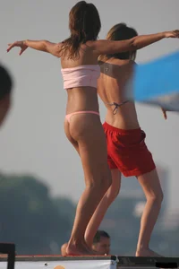 A bunch of sexy beach voyeur babes in bikinis, thongs and topless
