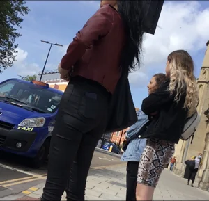 Chav brunette with a nice ass and vpl in tight black leather pants