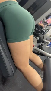 Green shorts bent over