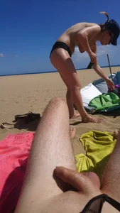 Topless teen girlfriend on the beach with nice tits