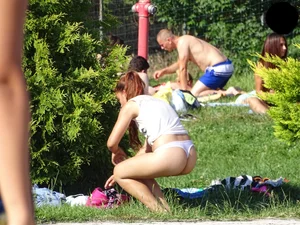 Hot chick with a nice ass at the pool in a white see through thong