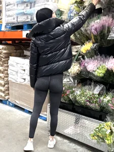 Girl in leggings with a perfect ass and slim legs picking flowers at the supermarket creepshots