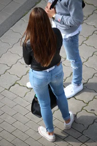 Pretty redhead in tight jeans with a nice booty