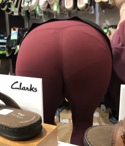 MILF in red leggings bends for the camera