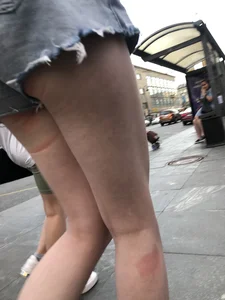 Street closeup of really hot legs and booty in fringed shorts