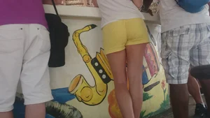 Milf in yellow shorts with vpl and a wedgie