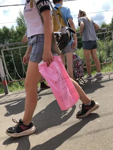 Cute Girl in Denim Shorts Walking Down a Railway Station Gallery