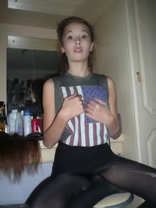 Cute girl in black pantyhose
