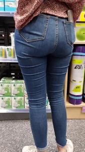 Brunette girl with nice ass sexy PAWG in tight jeans in a store