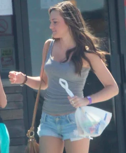 Beautiful tall teen in short denim shorts