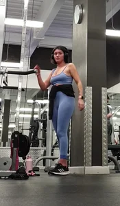 Bending gym babe stern face
