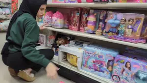 Hijab Princess stocking shelves @ department store