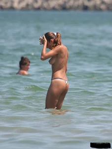 A bunch of sexy beach voyeur babes in bikinis, thongs and topless