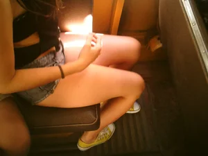 Sexy girl on the bus in jean shorts with nice legs and cleavage
