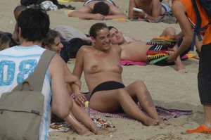 Topless girls on a beach in Barcelona