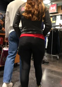Pretty girl shopping with boyfriend in leggings with a nice ass