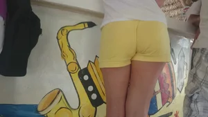 Milf in yellow shorts with vpl and a wedgie