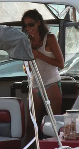 Bikini babe on a boat with a wet see through white shirt showing her tits