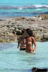 Nude beach ladies in the water showing their tits