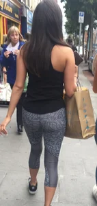 Sexy girl walking in grey patterned leggings with friend in tight jeans