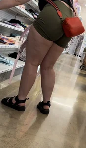 Juicy brunette in green spandex shorts OC