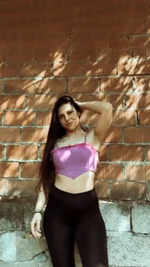 Non-candid hottie in a crop top and leggings