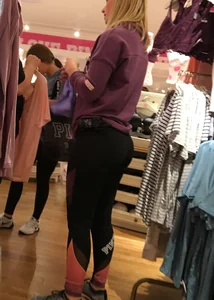 Pink employee with a perfectly round ass in leggings