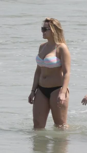 Big boobed thick blonde on the beach in a bikini