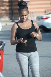 Ebony milf out shopping in grey leggings