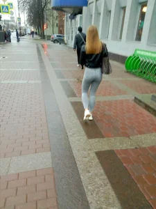 Girl With a Juicy Booty And Legs in Light Blue Tight Jeans Walking Down a Winter Street