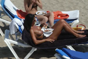 Girls on a nude beach in Sitges, Spain