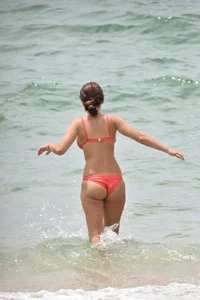 Two sexy ass girls on the beach in bikinis