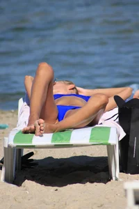 A couple sexy girls laying out on the beach