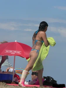Couple of thick beach teens in little thong bikinis