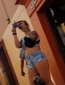 Nice legs and a little peach showing, shorts