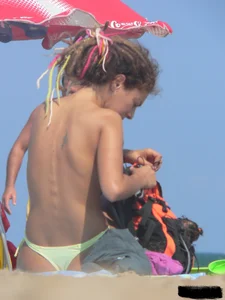 Sexy girls going topless at the beach showing off their sexy bodies
