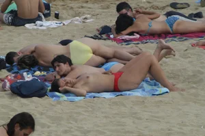 Topless girls on a beach in Barcelona