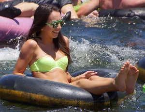 Sexy party girls in bikinis on a lake