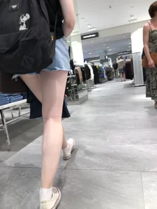 Hot Girl with Pale Skin in a Store Wearing Blue Denim Shorts Creepshots