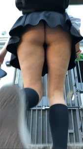 Girl Walking up the Stairs in a Skirt Candid