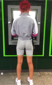 Super tight candid ebony babe in tight shorts with vtl at the ATM jiggles it for the camera