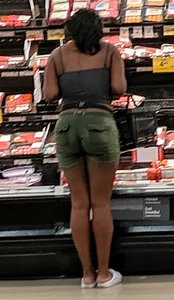 Ebony chick grocery shopping in green shorts
