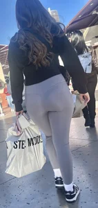 Sexy girl in grey leggings showing ass and cameltoe