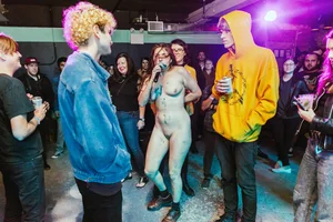 Only one is nude - group photos where only 1 girl is naked, and the rest of the people are dressed
