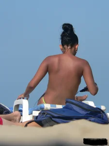 Hot ass topless beach girl with great tits lets her little brother oil up her ass in thong bikini