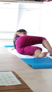Sexy girlfriend doing yoga at home in leggings