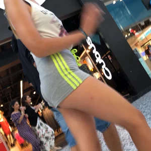 Blonde in little grey shorts with vpl showing her ass cheeks and slight camel toe