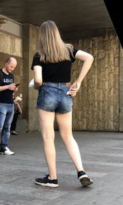 Cute Girl Distributing Leaflets in Shorts City Candid Gallery